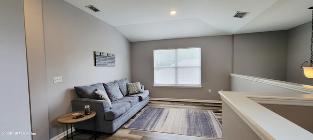 1691 Canopy Oaks Dr, Orange Park, FL 32065 - living area with wood finished floors, lofted ceiling, and baseboards