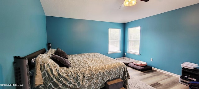 1691 Canopy Oaks Dr, Orange Park, FL 32065 - bedroom with wood finished floors, baseboards, and a ceiling fan