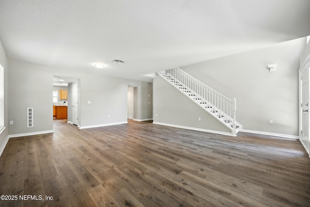 172 King Arthur Ct, Saint Augustine, FL 32086 - unfurnished living room featuring dark wood-style floors, stairs, and baseboards