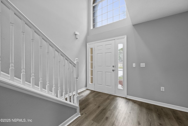 172 King Arthur Ct, Saint Augustine, FL 32086 - entrance foyer with wood finished floors, baseboards, stairway, and a towering ceiling