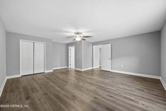 172 King Arthur Ct, Saint Augustine, FL 32086 - unfurnished bedroom featuring baseboards, dark wood-type flooring, a closet, and ceiling fan