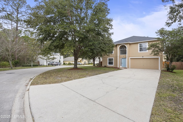 172 King Arthur Ct, Saint Augustine, FL 32086 - view of front of property featuring driveway, an attached garage, and stucco siding