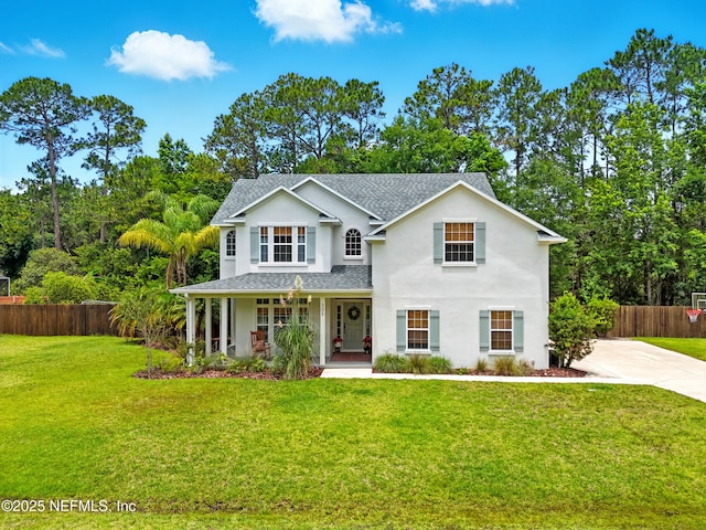 309 Elza Ln, Saint Augustine, FL 32086 - traditional-style home with covered porch, a shingled roof, and stucco siding