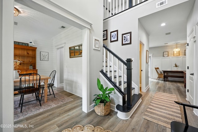 309 Elza Ln, Saint Augustine, FL 32086 - stairs featuring wood finished floors, baseboards, and wood walls