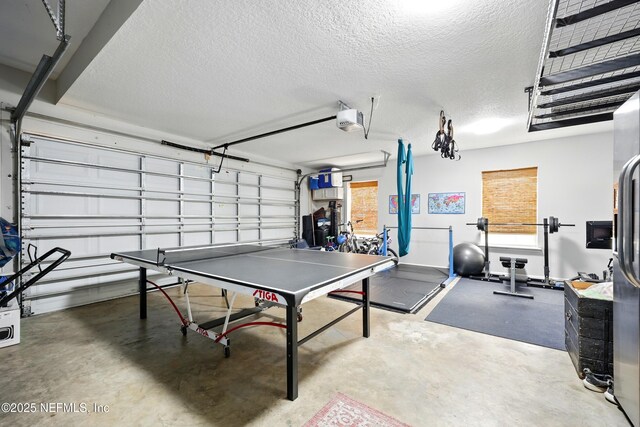 309 Elza Ln, Saint Augustine, FL 32086 - rec room with a garage, concrete flooring, and a textured ceiling