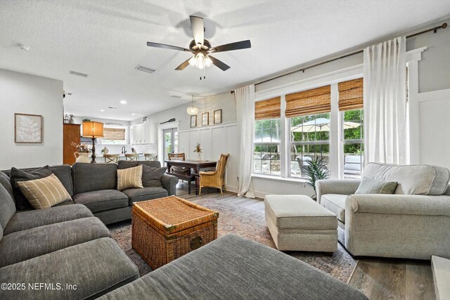 309 Elza Ln, Saint Augustine, FL 32086 - living area with wood finished floors, ceiling fan, and a textured ceiling
