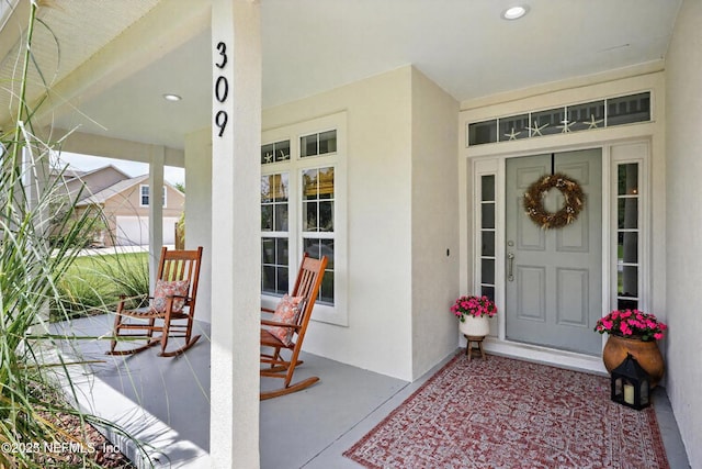 309 Elza Ln, Saint Augustine, FL 32086 - entrance to property featuring covered porch and stucco siding