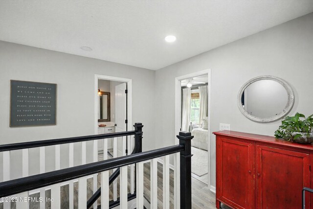 309 Elza Ln, Saint Augustine, FL 32086 - corridor with an upstairs landing, wood finished floors, and recessed lighting