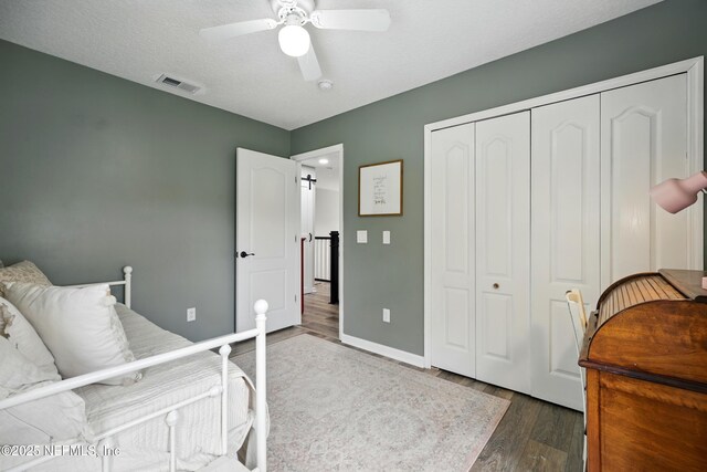309 Elza Ln, Saint Augustine, FL 32086 - bedroom featuring wood finished floors, a closet, a ceiling fan, and baseboards
