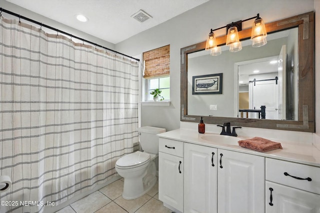 309 Elza Ln, Saint Augustine, FL 32086 - full bathroom with toilet, vanity, tile patterned floors, a shower with shower curtain, and recessed lighting