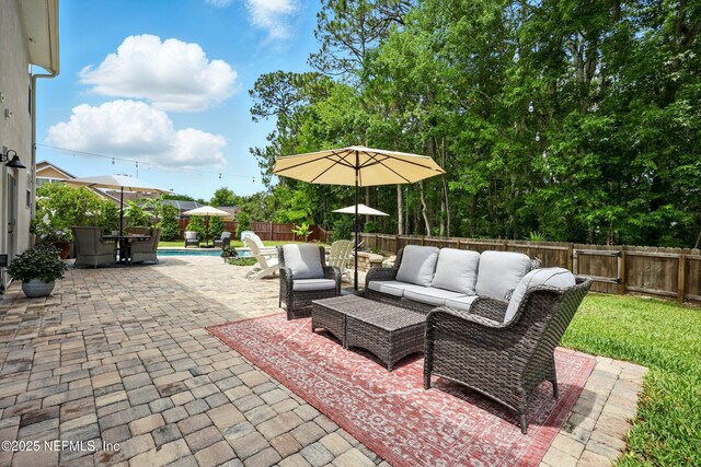 309 Elza Ln, Saint Augustine, FL 32086 - fenced backyard featuring an outdoor hangout area and a patio area