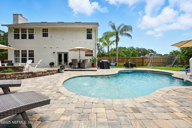 309 Elza Ln, Saint Augustine, FL 32086 - view of swimming pool featuring french doors and a patio area