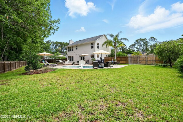 309 Elza Ln, Saint Augustine, FL 32086 - back of house with a patio area and a chimney