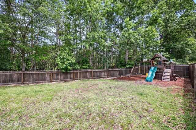 309 Elza Ln, Saint Augustine, FL 32086 - view of yard with a playground and view of scattered trees
