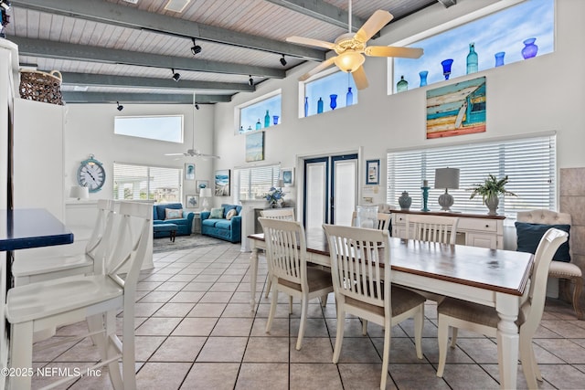 5473 Pelican Way, Saint Augustine, FL 32080 - dining area featuring ceiling fan, wooden ceiling with exposed beams, light tile patterned floors, and a towering ceiling