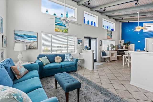 5473 Pelican Way, Saint Augustine, FL 32080 - living area featuring ceiling fan, a towering ceiling, track lighting, wood ceiling with exposed beams, and tile patterned flooring