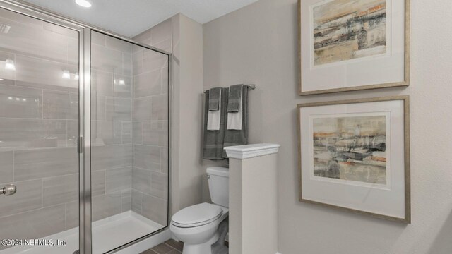 6951 Gable Grove Ave, Jacksonville, FL 32217 - bathroom featuring toilet and a shower stall