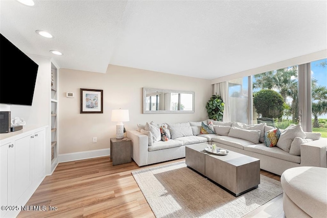 1185 Beach Walker Rd Unit 1185, Fernandina Beach, FL 32034 - living area featuring light wood-type flooring, baseboards, and recessed lighting
