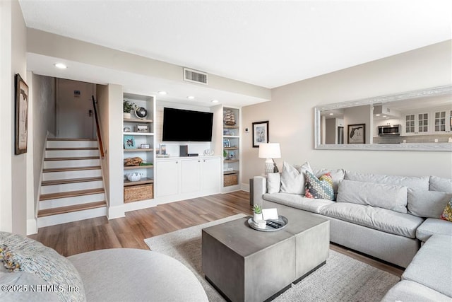1185 Beach Walker Rd Unit 1185, Fernandina Beach, FL 32034 - living room featuring wood finished floors, stairs, baseboards, and recessed lighting