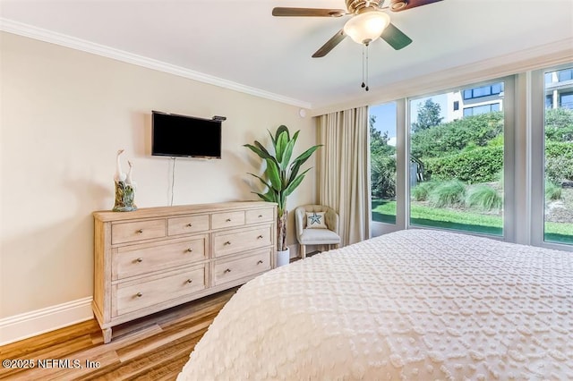 1185 Beach Walker Rd Unit 1185, Fernandina Beach, FL 32034 - bedroom featuring baseboards, ornamental molding, wood finished floors, and ceiling fan