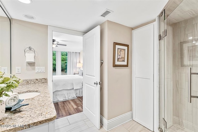 1185 Beach Walker Rd Unit 1185, Fernandina Beach, FL 32034 - full bath featuring a shower stall, vanity, a ceiling fan, and ensuite bathroom