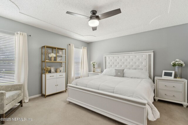 2000 Belhaven Dr, Orange Park, FL 32065 - bedroom with carpet floors, a textured ceiling, and ceiling fan