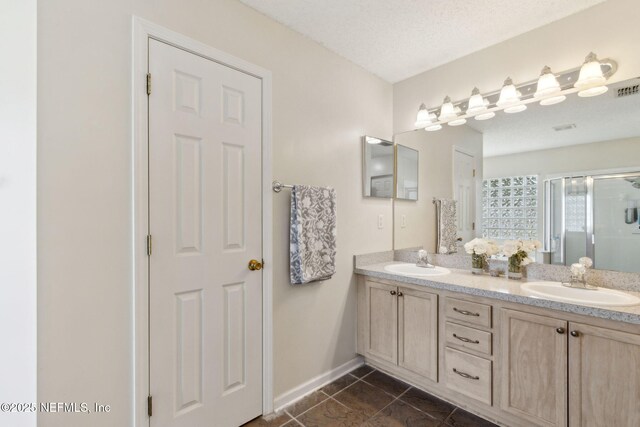 2000 Belhaven Dr, Orange Park, FL 32065 - bathroom featuring double vanity, a stall shower, tile patterned floors, and baseboards