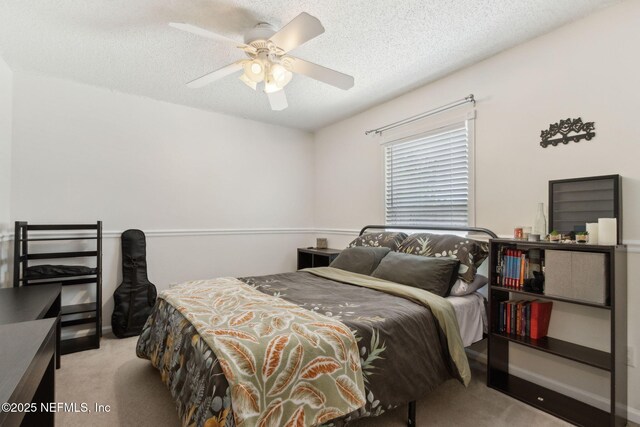 2000 Belhaven Dr, Orange Park, FL 32065 - carpeted bedroom featuring a textured ceiling and a ceiling fan