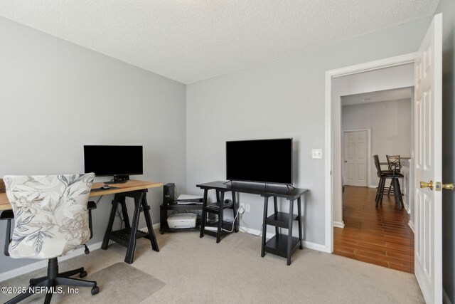 2000 Belhaven Dr, Orange Park, FL 32065 - carpeted office space featuring a textured ceiling and baseboards