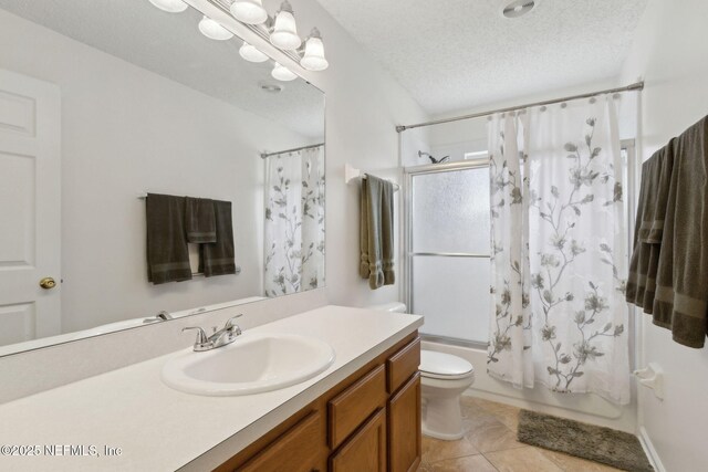 2000 Belhaven Dr, Orange Park, FL 32065 - full bath with vanity, shower / bathtub combination with curtain, toilet, tile patterned floors, and a textured ceiling
