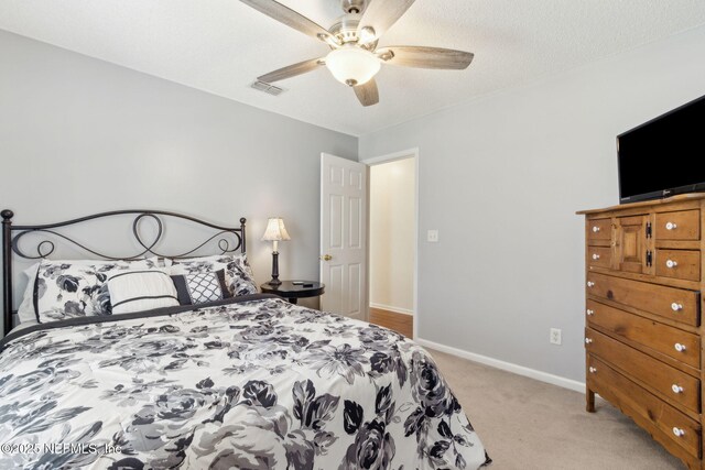 2000 Belhaven Dr, Orange Park, FL 32065 - bedroom with light colored carpet, baseboards, and ceiling fan