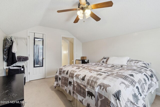 2000 Belhaven Dr, Orange Park, FL 32065 - bedroom featuring light colored carpet, lofted ceiling, ceiling fan, and a textured ceiling