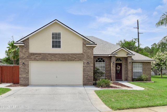2000 Belhaven Dr, Orange Park, FL 32065 - traditional-style home with concrete driveway, brick siding, roof with shingles, stucco siding, and a garage