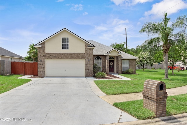 2000 Belhaven Dr, Orange Park, FL 32065 - traditional home featuring an attached garage, concrete driveway, brick siding, roof with shingles, and stucco siding