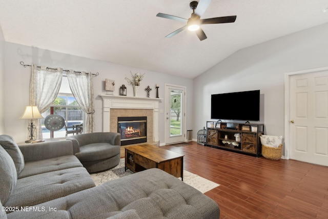 2000 Belhaven Dr, Orange Park, FL 32065 - living area featuring lofted ceiling, ceiling fan, wood finished floors, and a tile fireplace