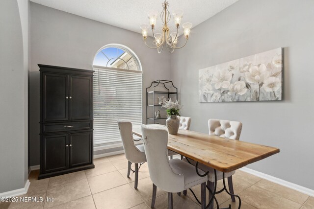 2000 Belhaven Dr, Orange Park, FL 32065 - dining space featuring a chandelier, baseboards, and light tile patterned floors