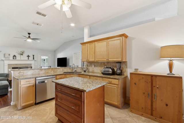 2000 Belhaven Dr, Orange Park, FL 32065 - kitchen with stainless steel dishwasher, a ceiling fan, a sink, open floor plan, and a peninsula