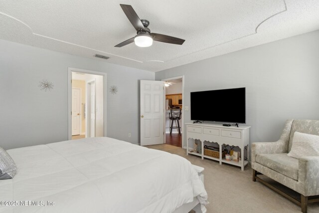 2000 Belhaven Dr, Orange Park, FL 32065 - bedroom featuring a textured ceiling, a ceiling fan, and light carpet
