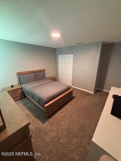 2358 Evening Oaks Ln, Green Cove Springs, FL 32043 - carpeted bedroom featuring baseboards and a textured ceiling