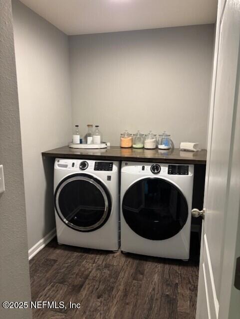 2358 Evening Oaks Ln, Green Cove Springs, FL 32043 - washroom with washing machine and dryer, dark wood-style flooring, and baseboards