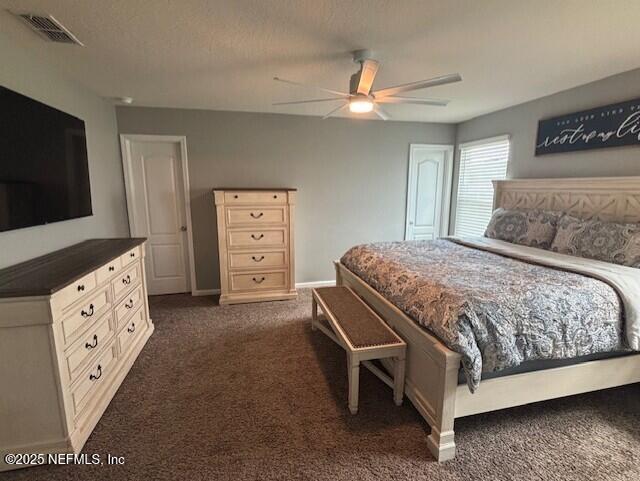 2358 Evening Oaks Ln, Green Cove Springs, FL 32043 - bedroom featuring dark colored carpet, baseboards, and ceiling fan