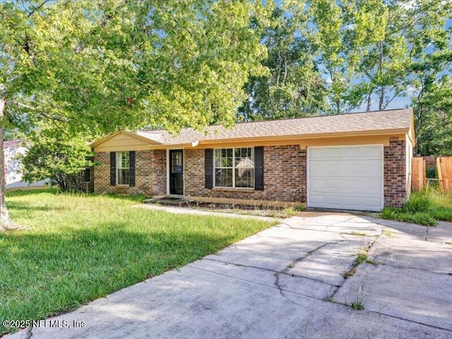 2704 Tina Ln, Middleburg, FL 32068 - ranch-style home with concrete driveway, brick siding, and an attached garage