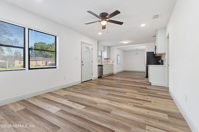3747 Copper Cir E, Jacksonville, FL 32207 - unfurnished living room featuring a ceiling fan, light wood-style flooring, baseboards, and recessed lighting