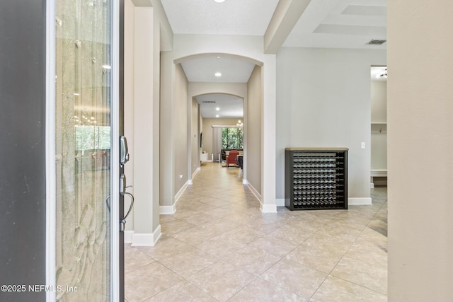 117 S Durbin Pkwy, Saint Johns, FL 32259 - corridor featuring light tile patterned floors, arched walkways, and baseboards