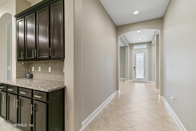 117 S Durbin Pkwy, Saint Johns, FL 32259 - corridor with arched walkways, light tile patterned floors, baseboards, and recessed lighting