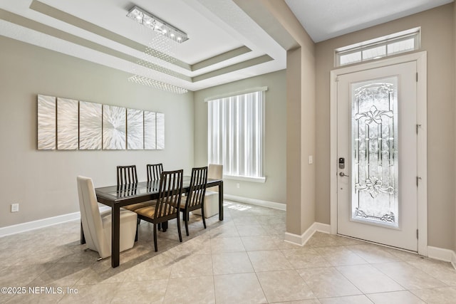 117 S Durbin Pkwy, Saint Johns, FL 32259 - dining space featuring plenty of natural light, baseboards, a tray ceiling, and light tile patterned flooring