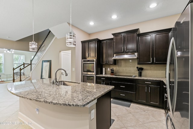 117 S Durbin Pkwy, Saint Johns, FL 32259 - kitchen featuring a sink, stainless steel appliances, under cabinet range hood, light tile patterned flooring, and tasteful backsplash