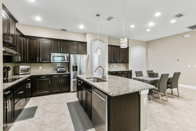 117 S Durbin Pkwy, Saint Johns, FL 32259 - kitchen with appliances with stainless steel finishes, a sink, tasteful backsplash, light tile patterned floors, and recessed lighting