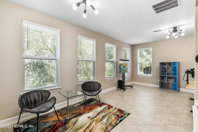 117 S Durbin Pkwy, Saint Johns, FL 32259 - sitting room featuring light tile patterned flooring, baseboards, and a textured ceiling