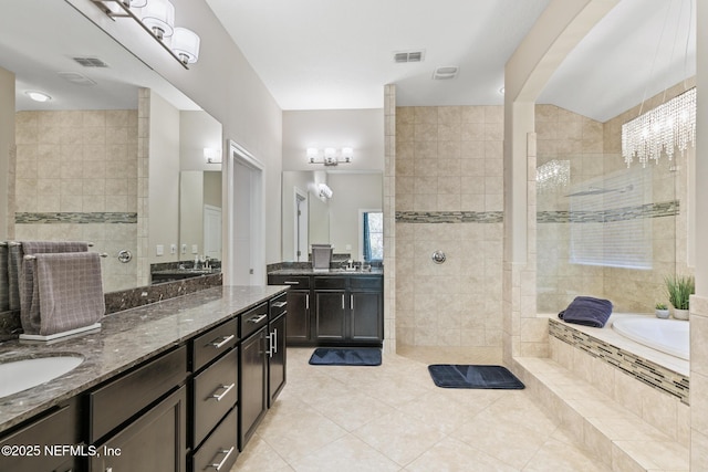 117 S Durbin Pkwy, Saint Johns, FL 32259 - full bathroom with tile patterned floors, a bath, two vanities, and walk in shower